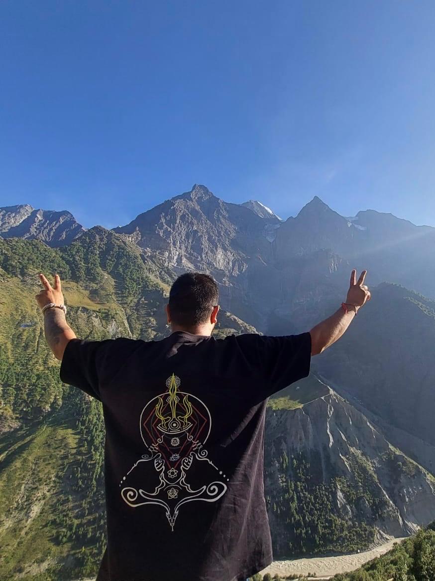 Shiva Linework Tee back view in the mountains